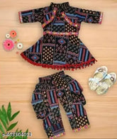 Printed black cotton blend dhoti pants and kurta set for girls, traditional Indian outfit in chic A-line style with short sleeves and knee length top